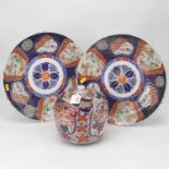 A pair of Japanese late Meiji period chargers typically decorated in the imari palette in shades