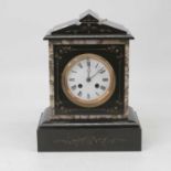 A late Victorian black slate and marble cased mantel clock of architectural form having a circular