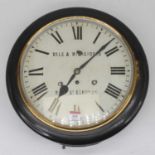 A Victorian school clock having a 30cm enamel dial with Roman numerals and outer track signed Vale &