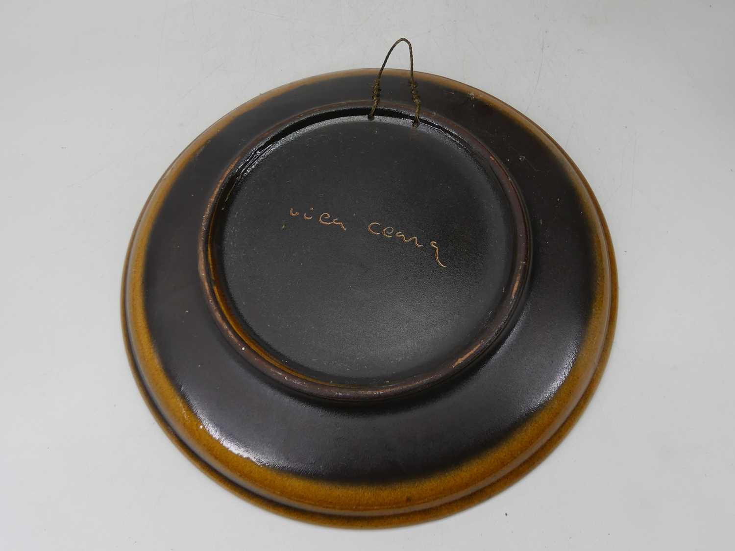 A 20th century continental studio pottery plate, incised with a musician, indistinctly signed verso, - Image 7 of 7