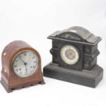 A late Victorian black slate and marble cased mantel clock having an enamelled chapter ring with