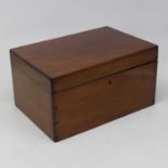 An early 20th century mahogany box, of typical rectangular form, the hinged lid opening to reveal