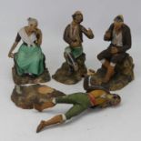 A collection of four Leon painted pottery figures, in various poses (a/f)