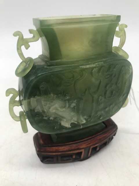 A Chinese spinach jadeite censor, of slab-sided form with raised decoration and loop handles, with