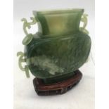 A Chinese spinach jadeite censor, of slab-sided form with raised decoration and loop handles, with