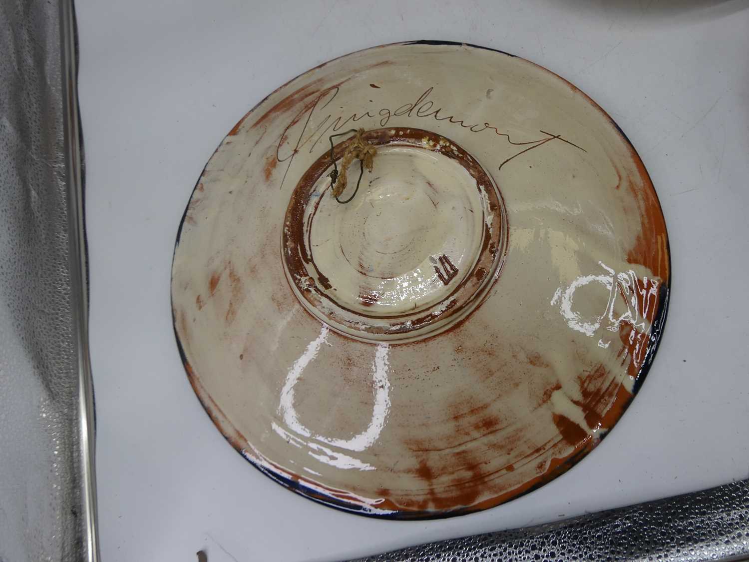 A 20th century continental studio pottery plate, incised with a musician, indistinctly signed verso, - Image 3 of 7