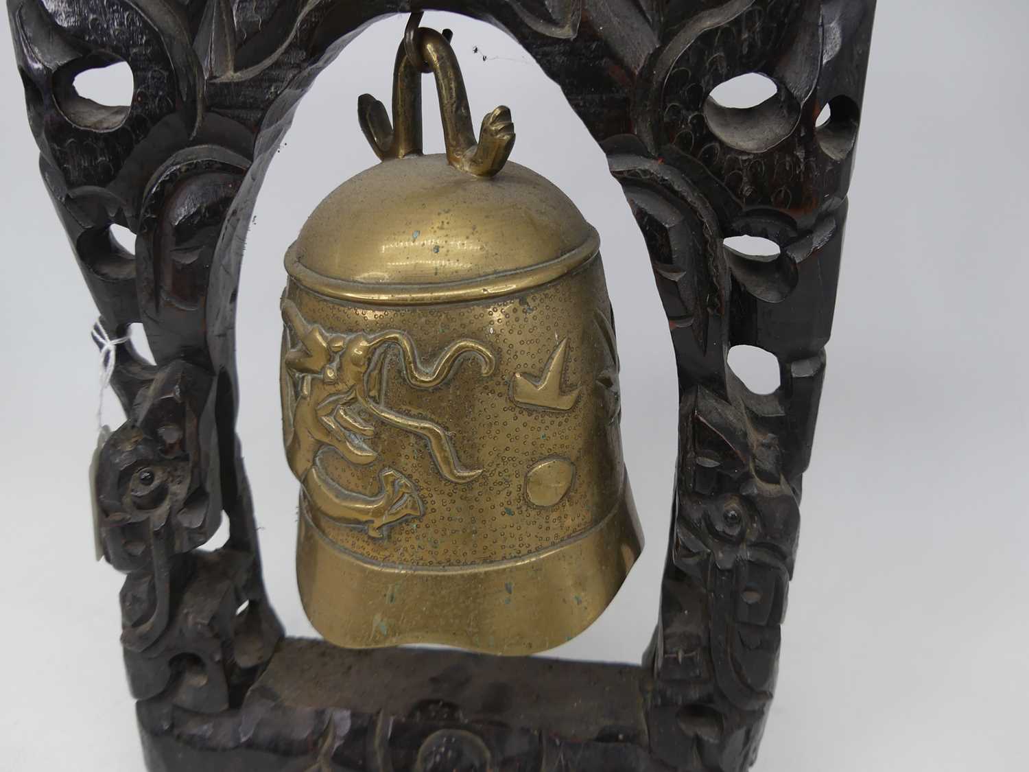 A 20th century temple bell, relief decorated with a dragon, suspended from a carved and pierced - Image 2 of 3