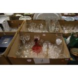 Two boxes of glassware to include a cranberry glass decanter