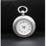 An American fine silver case ladies open face pocket watch having engraved case and key wind