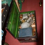 A vintage tin trunk, containing a collection of metalware to include oil lamp