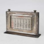 A George V silver clad desk-top calendar, inscribed 'The Motor', w.21cm