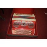 A vintage Junior accordion, cased