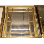 A reproduction gilt composition framed rectangular sectional wall mirror, 98 x 84cm