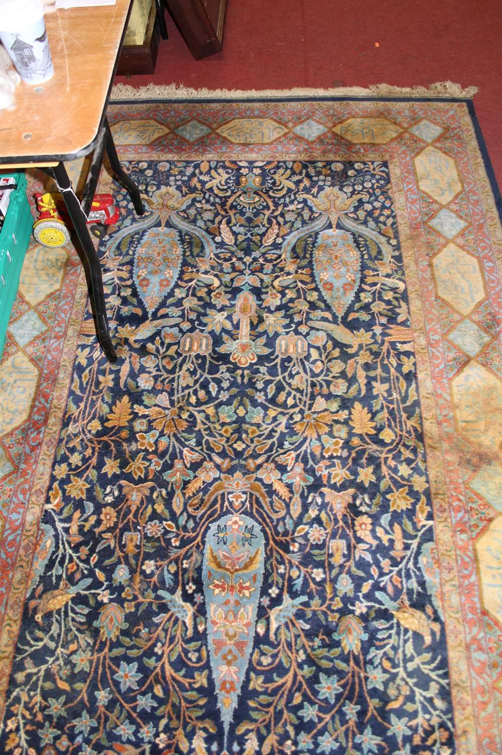 A Persian woollen blue ground rug, the heavily decorated central ground within trailing tramline - Image 3 of 4