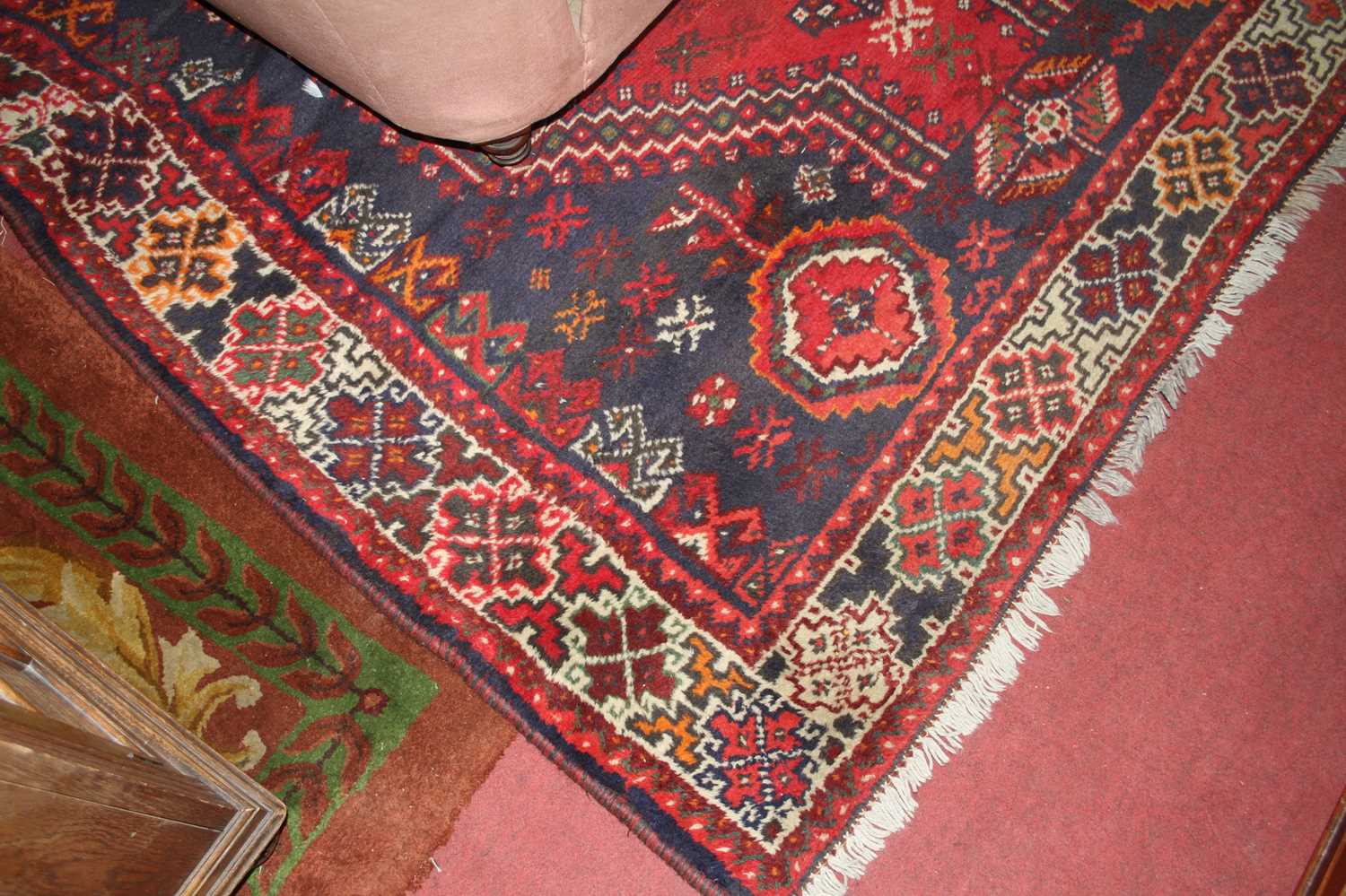 A Persian woollen red ground Shiraz rug, with all over floral geometric ground, 278 x 197cm - Image 2 of 3