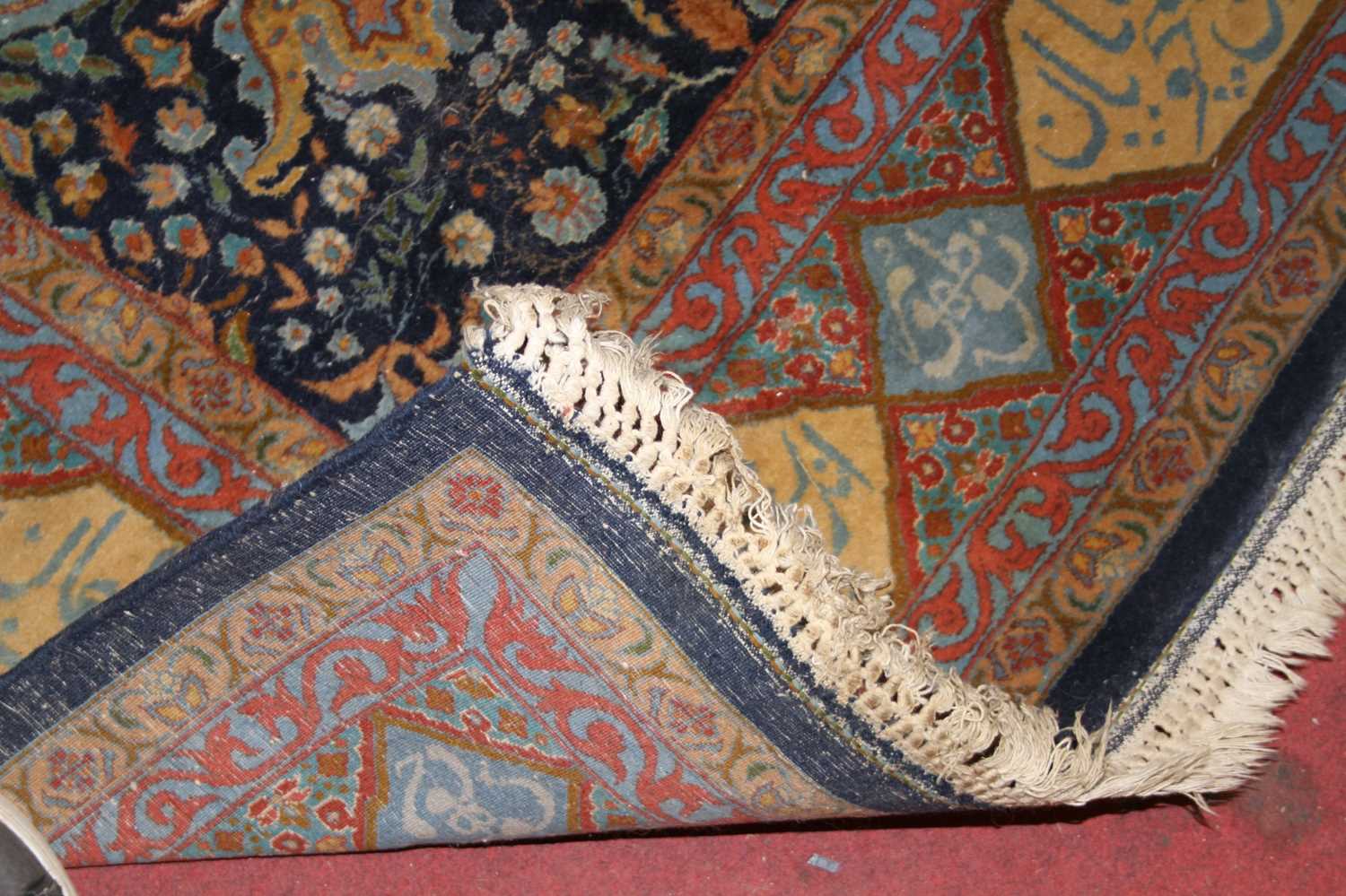 A Persian woollen blue ground rug, the heavily decorated central ground within trailing tramline - Image 4 of 4