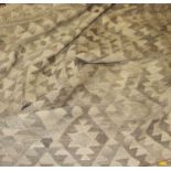 A Turkish Kelim woollen pale ground rug with tasselled ends, W240cm, L292cm