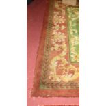 A green and red ground Stockwell carpet, floral decorated in the classical taste, 280 x 280cm