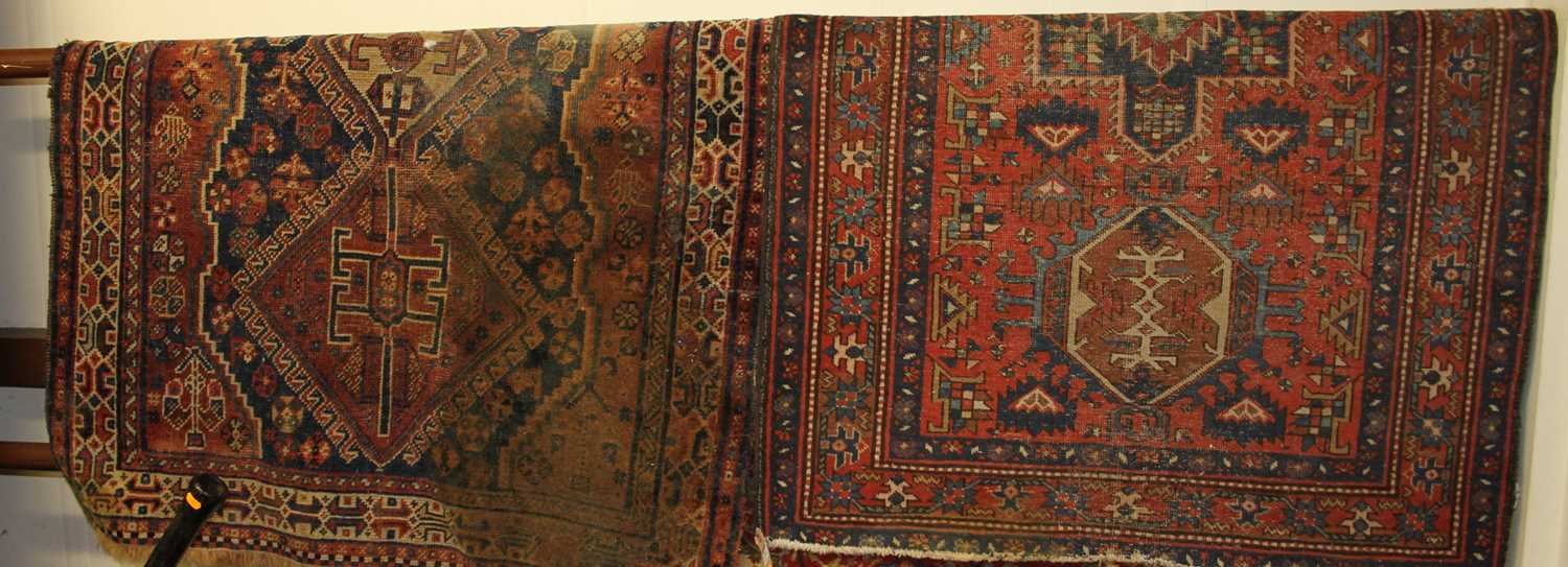 A Persian woollen red ground Shiraz rug 145 x 100cm, together with one other (2)