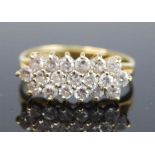 An 18ct yellow gold diamond lozenge shaped cluster ring, featuring 19 melee cut diamonds in claw