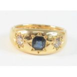 A late Victorian 18ct yellow gold, synthetic sapphire and diamond ring, featuring a centre oval