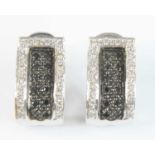 A pair of white metal diamond multi-stone hinged half-hoop earrings, with post and omega fittings,