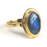 A yellow metal opal triplet ring, the black opal triplet measuring approx 11.55 x 7.39 x 2.65mm, and