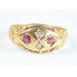 An 18ct yellow gold Edwardian ruby and diamond boat shaped dress ring, featuring two round faceted