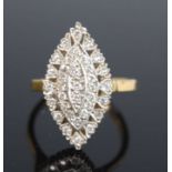 An 18ct yellow and white diamond navette shaped cluster ring featuring 35 round brilliant cut