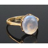 A yellow metal moonstone dress ring, the oval moonstone cabochon measuring approx 10 x 8.4 x 3.