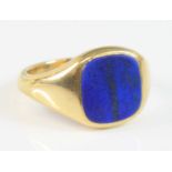 An 18ct yellow gold lapis lazuli cushion shaped signet ring, the lapis tablet measuring approx 11.