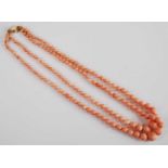 A two-row coral necklace, featuring a row of 77 and a row of 80 approx 5.5 to 13.1mm graduated coral