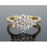 An 18ct yellow and white gold diamond navette shaped cluster ring, comprising 16 round brilliant cut