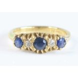 A yellow metal, sapphire and diamond five-stone half-hoop eternity ring, featuring three graduated