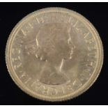 Great Britain, 1965 gold full sovereign, Elizabeth II, rev: St George and Dragon above date. (1)