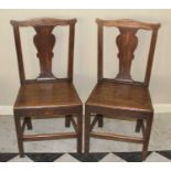 A pair of early 19th century provincial oak panelled seat splatback dining chairs, w.45cm