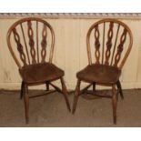 A pair of 19th century elm and yew splat and stick back kitchen chairs, having dished seats and