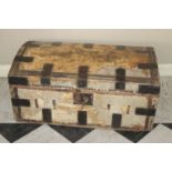 A 19th century hide, metal bound and further studded domed hinge topped travelling trunk, having