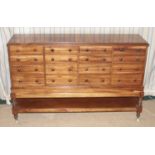 A 19th century Goncalo Alves collectors chest, having four banks of four graduated drawers with