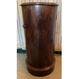 A Victorian mahogany cylindrical single door bedside cupboard, on plinth, h.77.5cm, dia.39cm