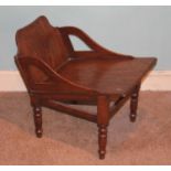 A 19th century oak gout stool, raised on turned supports, length 54cmSplit to back panel running