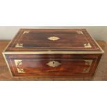 A Regency rosewood and brass inlaid fold-over writing slope, having a baize lined