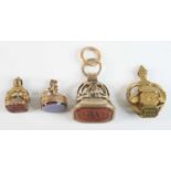 Four assorted yellow metal fob pendants, being a yellow fob with a 23x17mm carnelian intaglio