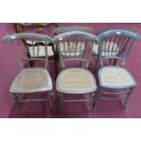 A collection of five similar Victorian floral polychrome painted barback cane seat bedroom chairs,