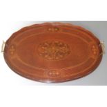 An Edwardian mahogany and floral satinwood inlaid oval twin handled drinks tray, with wavy raised
