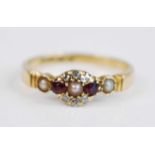 A late Victorian 18ct yellow gold, garnet, diamond and seed pearl cluster ring, featuring two oval