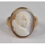 A 9ct yellow gold cameo ring, the oval shell cameo depicting a Georgian lady in a plain mount,