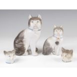 A Victorian Staffordshire model of a cat, shown in seated pose, h.18cm, together with another