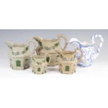 A graduated set of four Staffordshire moulded jugs, circa 1800, each in the form of a cottage,