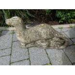 A reconstituted stone garden ornamental model of an otter, length 56cmWeathered but no apparent